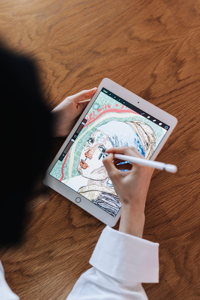 Woman drawing digital artwork on a tablet using a stylus.